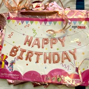 Rose gold happy birthday balloons with ribbon